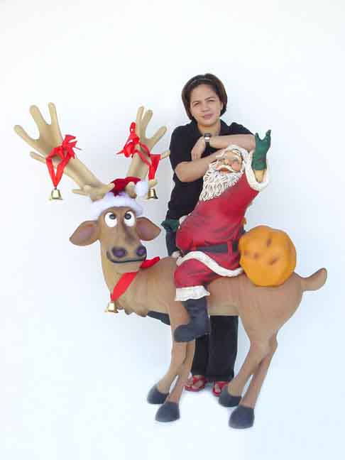 Funny Reindeer standing with Santa Claus