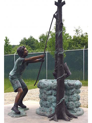 Bronze Boy Drawing Water From Well