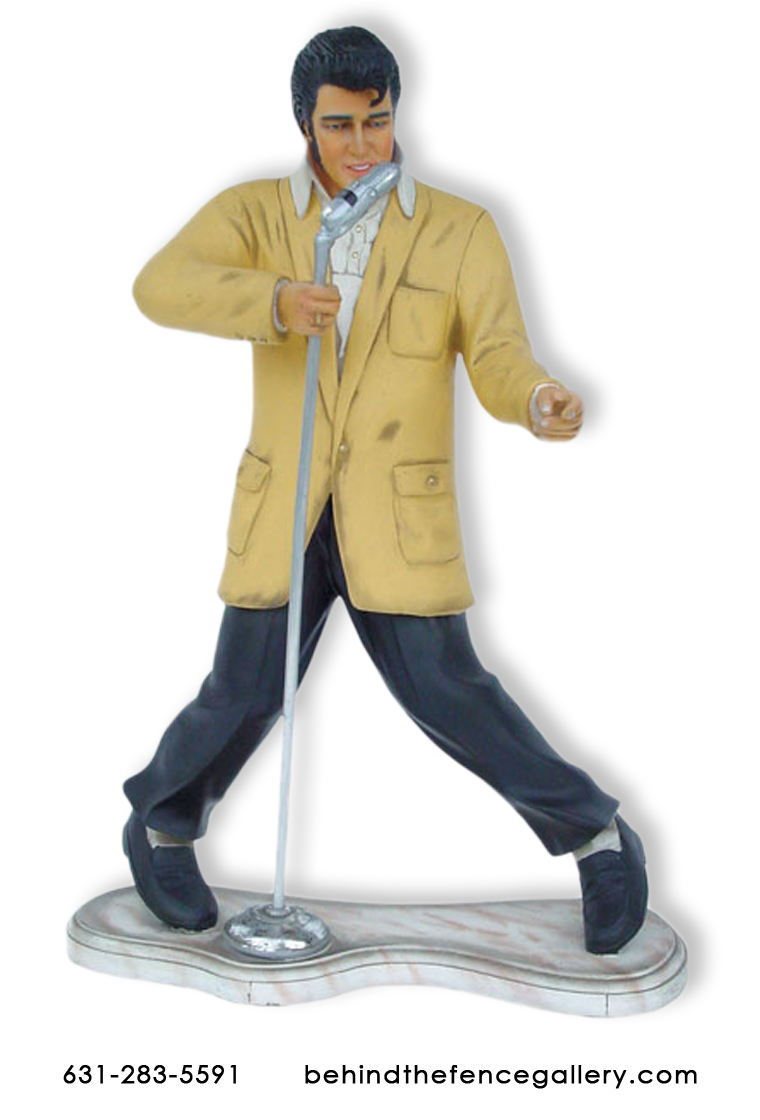 Elvis Presley standing singing into Microphone