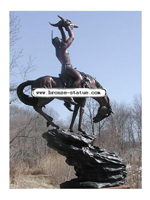 Bronze Indian holding Buffalo Skull