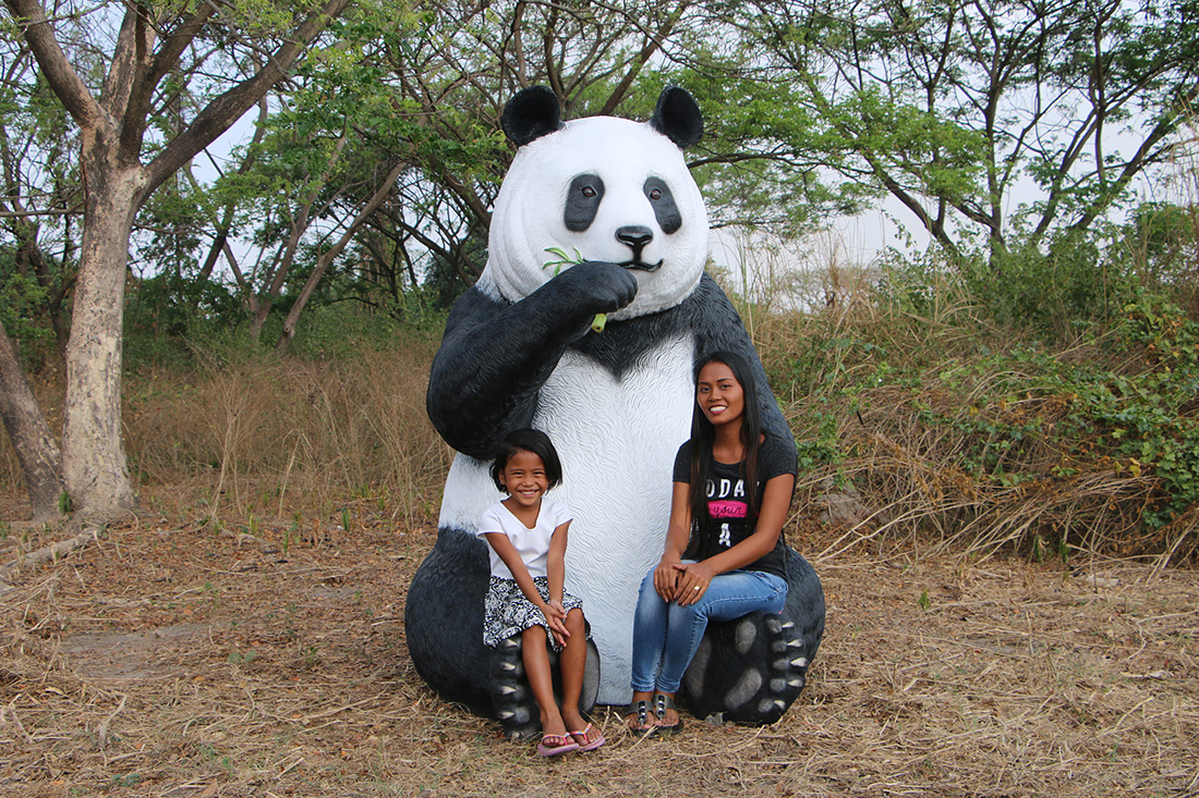 Giant Sitting Panda Bear Eating Fiberglass Statue